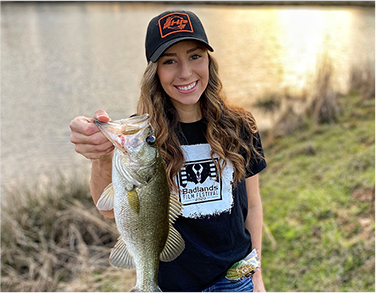 girl holding a catfish