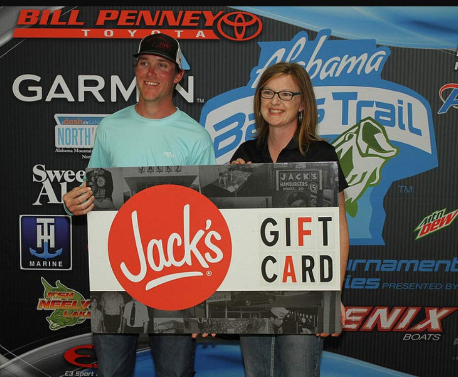 couple holding jacks gift card