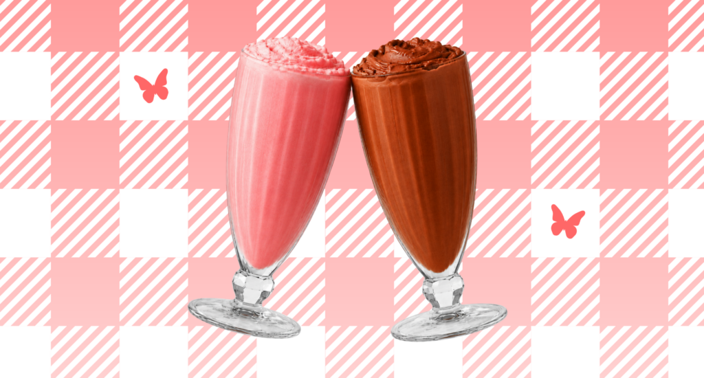 Two Jack’s milkshakes, one strawberry and one chocolate, clinking together against a pink and white checkered background with butterfly accents.